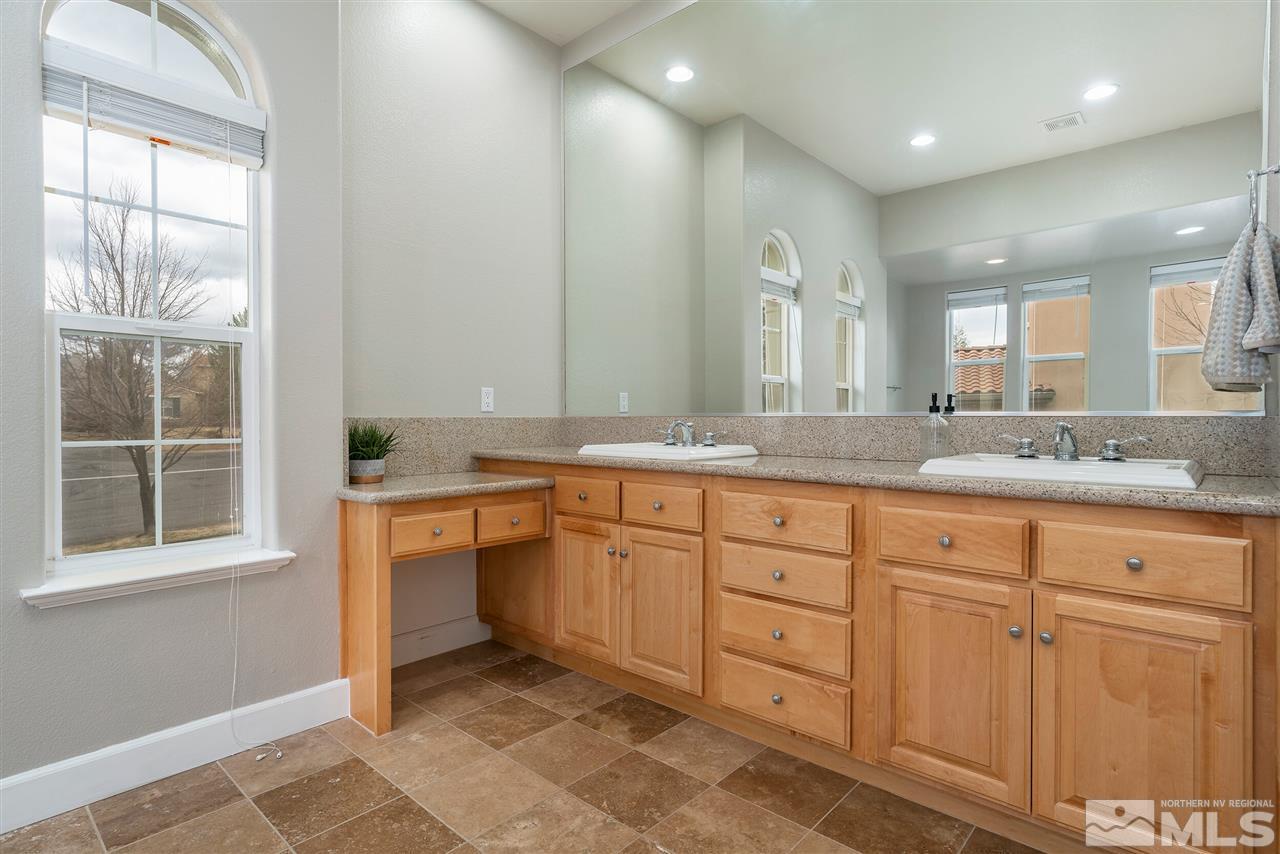 8475 Fairway Chase Trail Reno, NV 89523 - Photo 14 of 40 a spacious bathroom with a granite countertop sink mirror and double