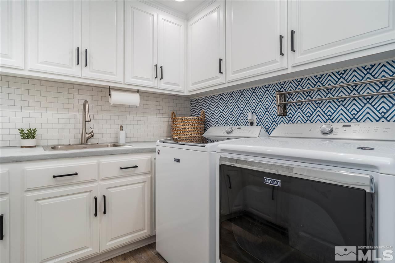 8475 Fairway Chase Trail Reno, NV 89523 - Photo 16 of 40 a kitchen with granite countertop white cabinets and white appliances