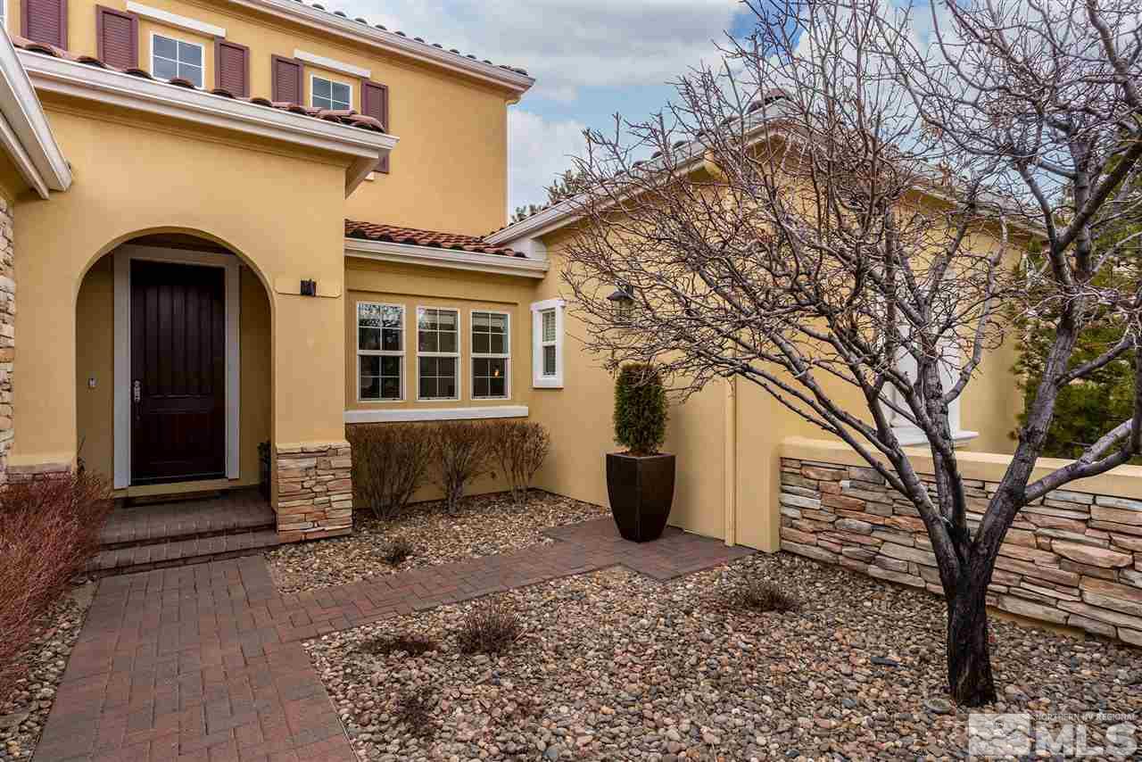 8475 Fairway Chase Trail Reno, NV 89523 - Photo 2 of 40 a front view of a house with a yard
