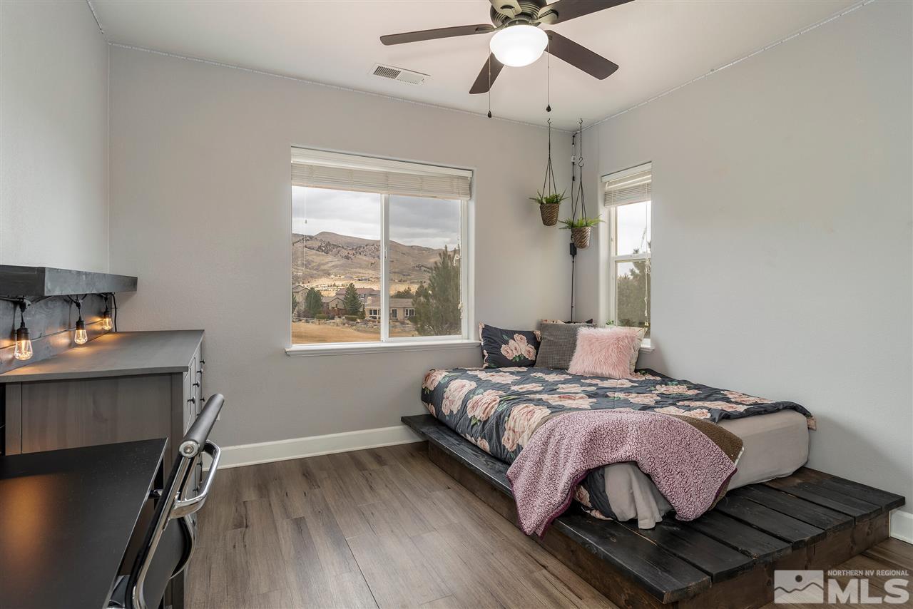 8475 Fairway Chase Trail Reno, NV 89523 - Photo 21 of 40 a bedroom with a bed and a window