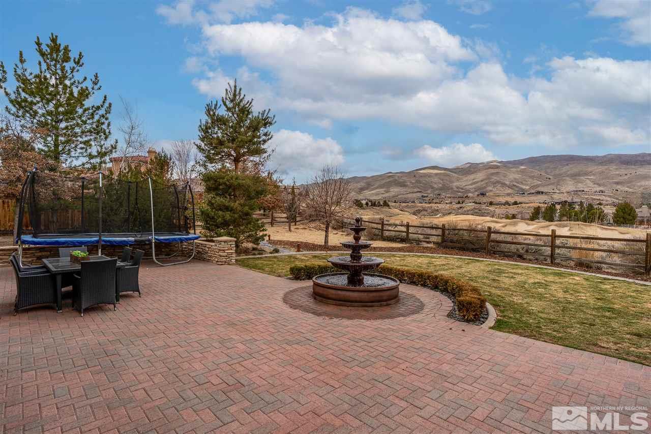 8475 Fairway Chase Trail Reno, NV 89523 - Photo 23 of 40 a view of a lake with a car parked