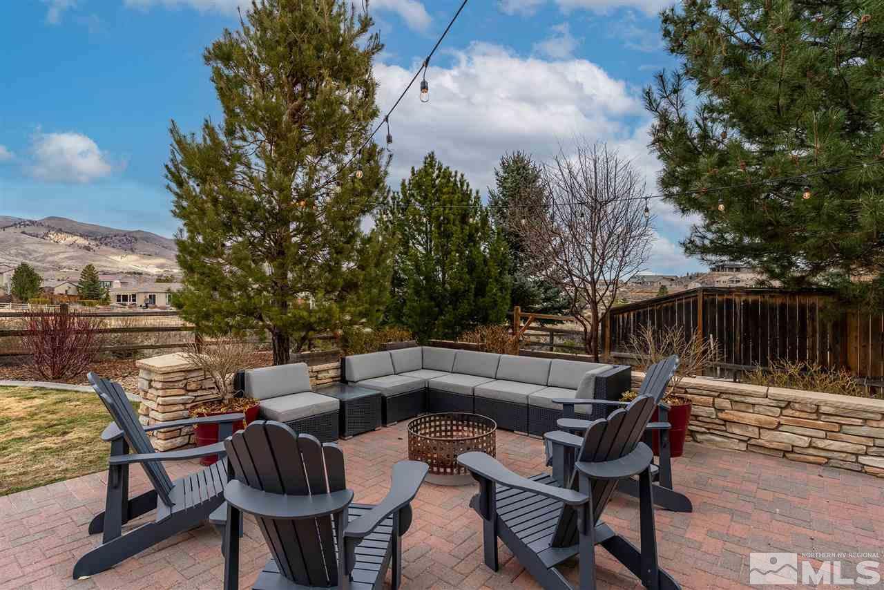 8475 Fairway Chase Trail Reno, NV 89523 - Photo 25 of 40 a view of patio with table and chairs and potted plants
