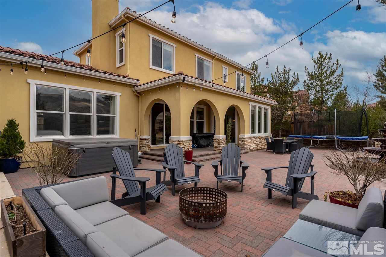 8475 Fairway Chase Trail Reno, NV 89523 - Photo 27 of 40 a view of a patio with couches table and chairs and potted plants