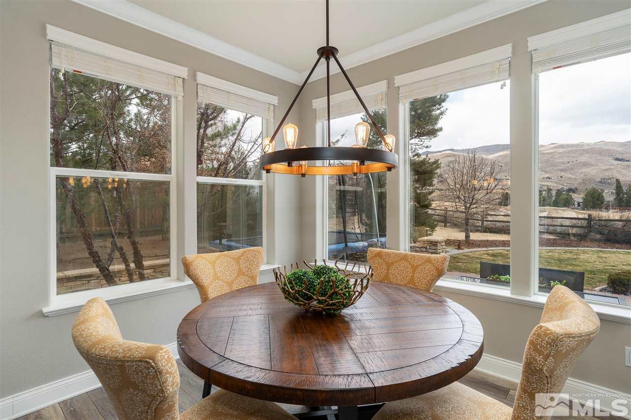 8475 Fairway Chase Trail Reno, NV 89523 - Photo 10 of 40 a view of a dining room with furniture wooden floor and a potted plant