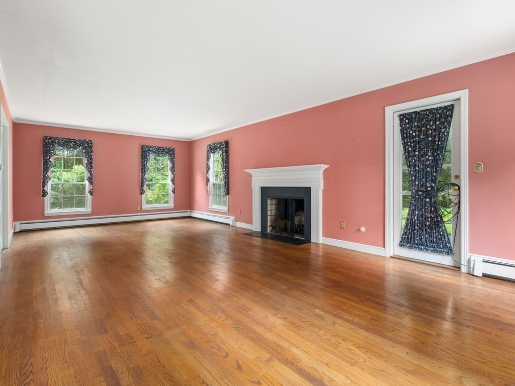 59 Spywood Road Sherborn, MA 01770 - Photo 11 of 40 a view of empty room with floor to ceiling window and wooden floor