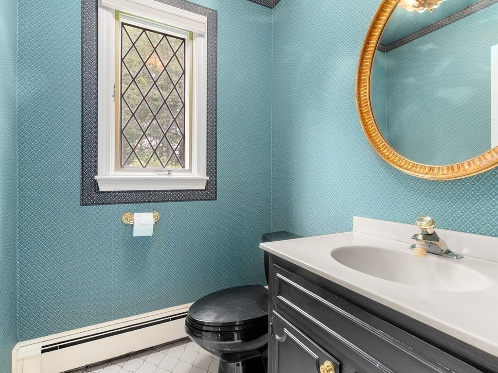 59 Spywood Road Sherborn, MA 01770 - Photo 14 of 40 a bathroom with a sink and a mirror