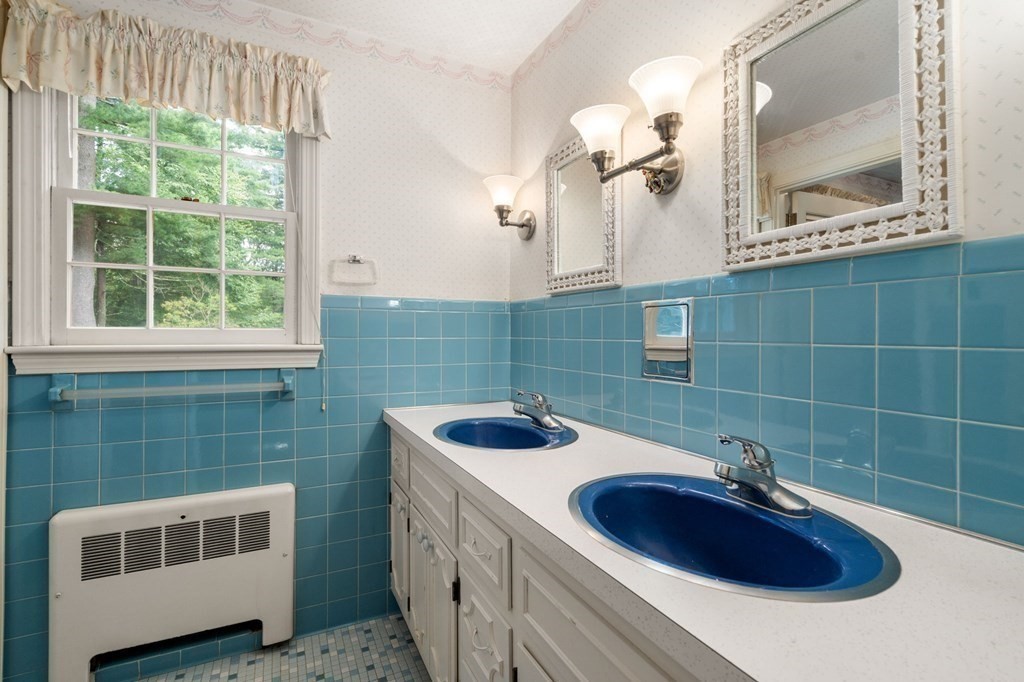 59 Spywood Road Sherborn, MA 01770 - Photo 17 of 40 a bathroom with a sink and a mirror
