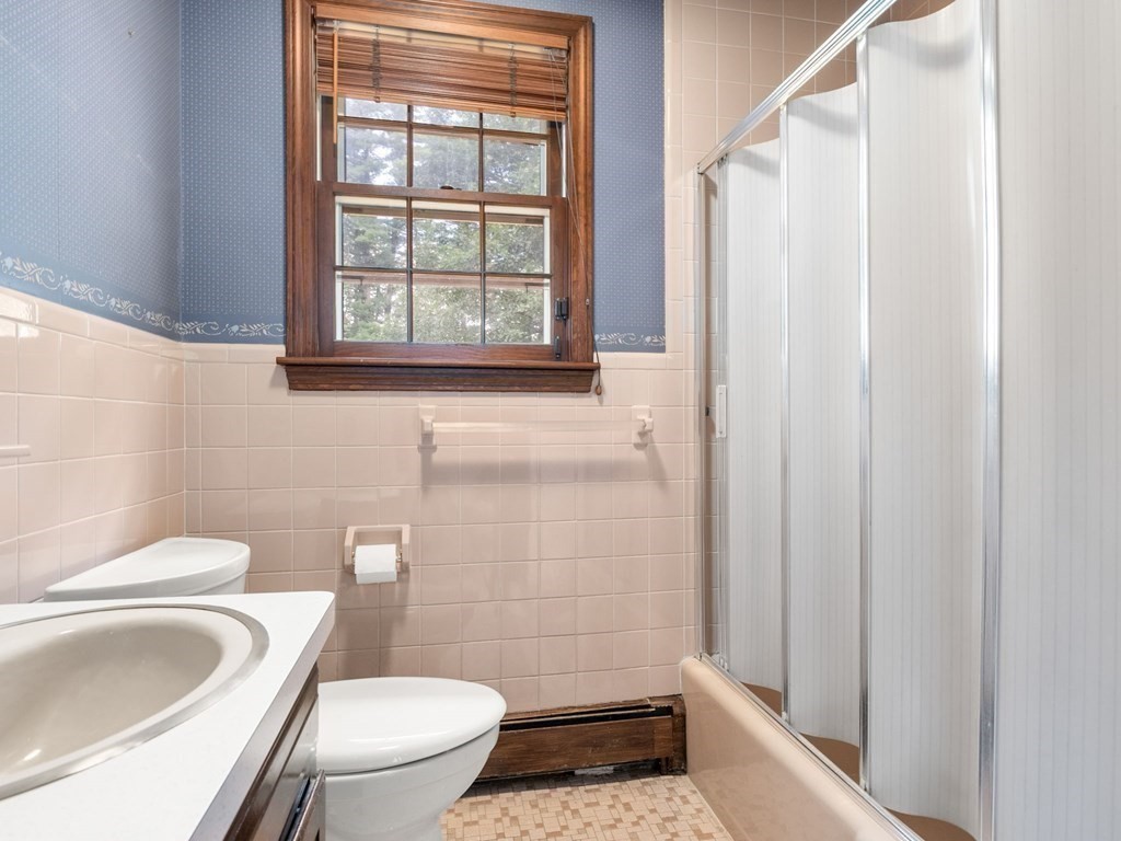 59 Spywood Road Sherborn, MA 01770 - Photo 26 of 40 a bathroom with a toilet and a shower