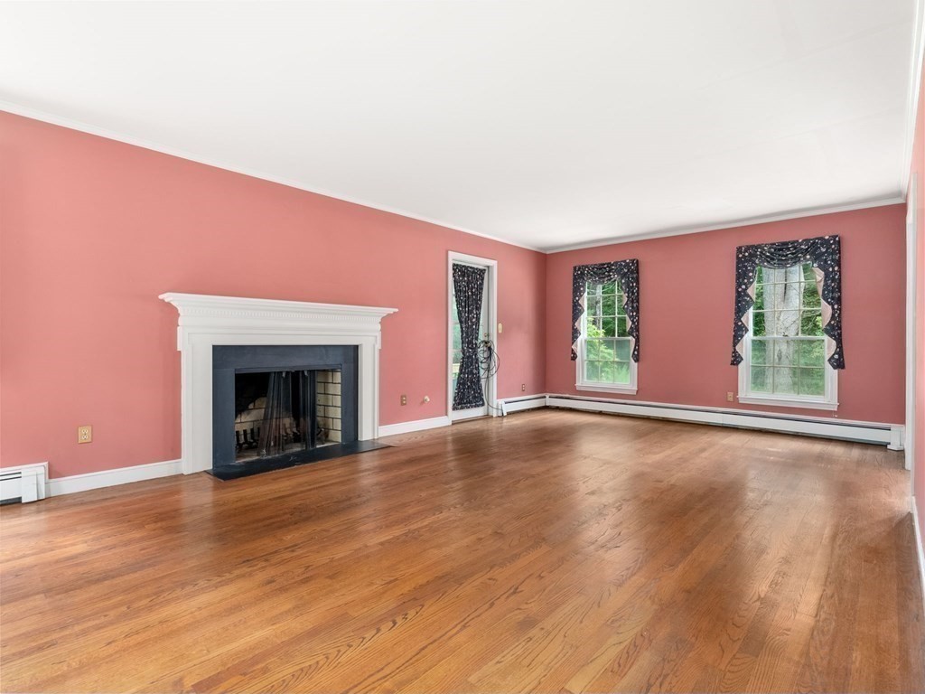 59 Spywood Road Sherborn, MA 01770 - Photo 6 of 40 a view of an empty room with wooden floor and a window