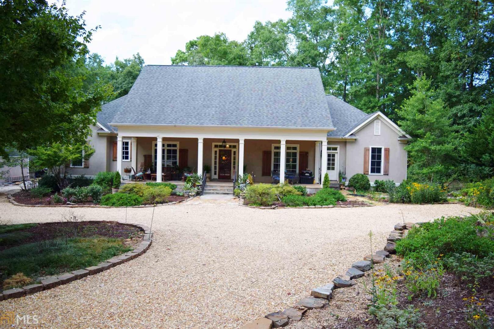 244 River Point Drive, Unit 9 LaGrange, GA 30240 - Photo 1 of 1 a front view of house with yard and green space
