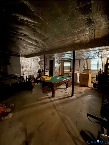 a living room with furniture a flat screen tv and a large window