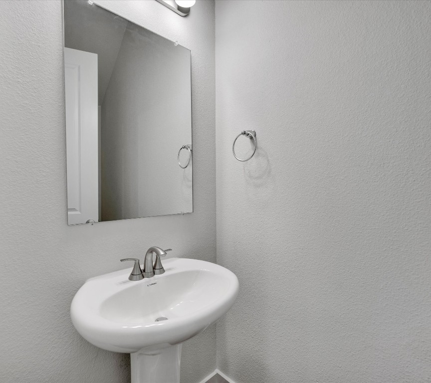2703-107 Rockhill Road McKinney, TX 75072 - Photo 13 of 31 a bathroom with a sink and a mirror