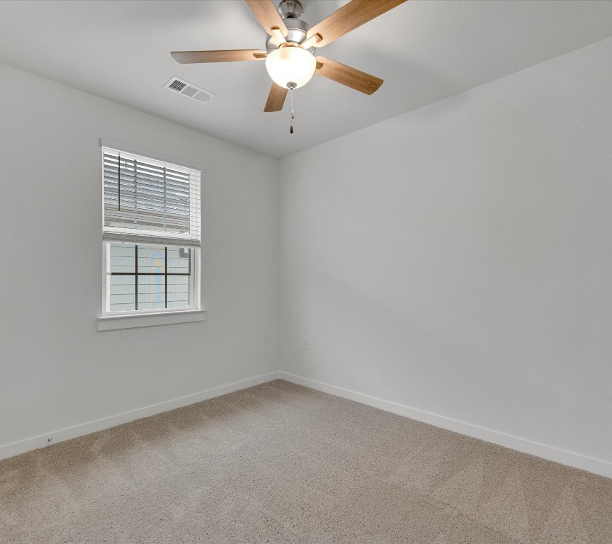 2703-107 Rockhill Road McKinney, TX 75072 - Photo 17 of 31 an empty room with a window and a fan
