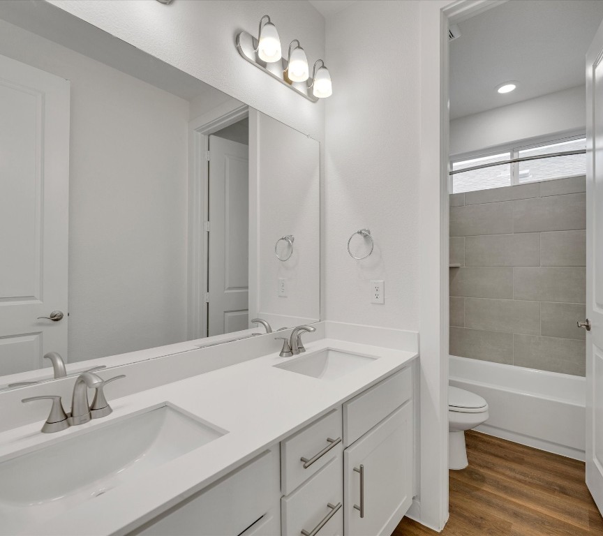 2703-107 Rockhill Road McKinney, TX 75072 - Photo 23 of 31 a bathroom with a sink a toilet and shower