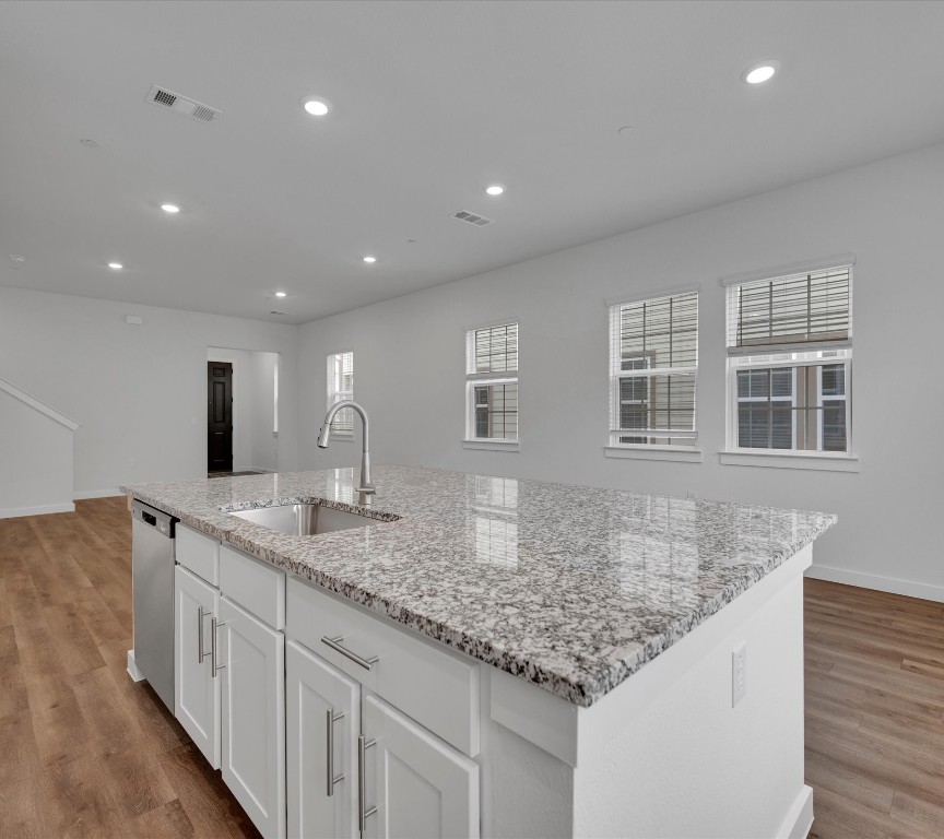 2703-107 Rockhill Road McKinney, TX 75072 - Photo 10 of 31 a kitchen with center island