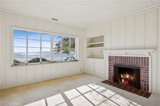 a view of a kitchen with a sink and a window