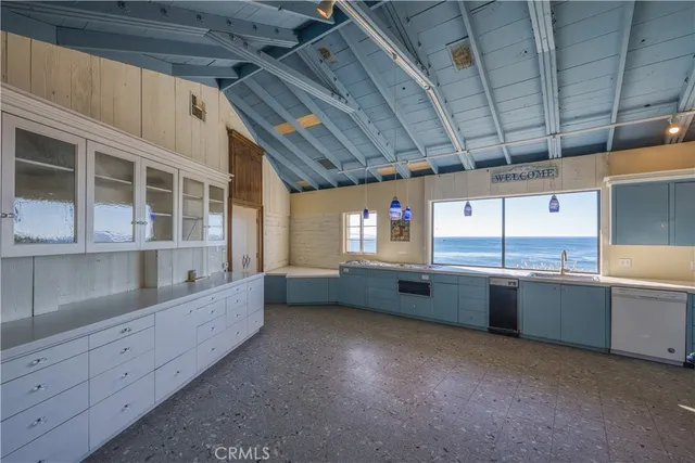 a bathroom with a granite countertop sink and mirror