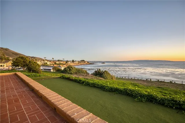 a view of a lake with a big yard