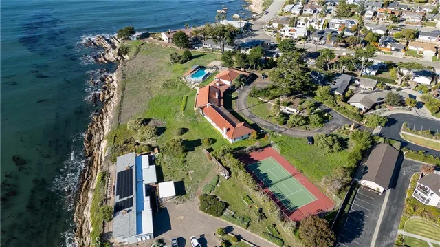an aerial view of a residential houses with outdoor space