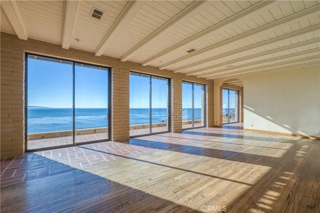 a view of balcony with wooden floor