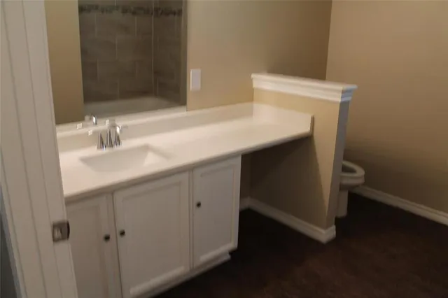 a bathroom with a glass door shower