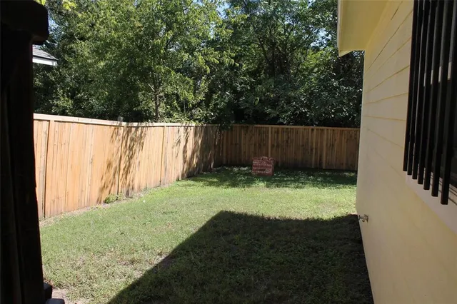 a view of backyard with tree