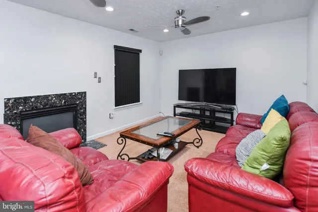 a view of a hallway with wooden floor and a large window