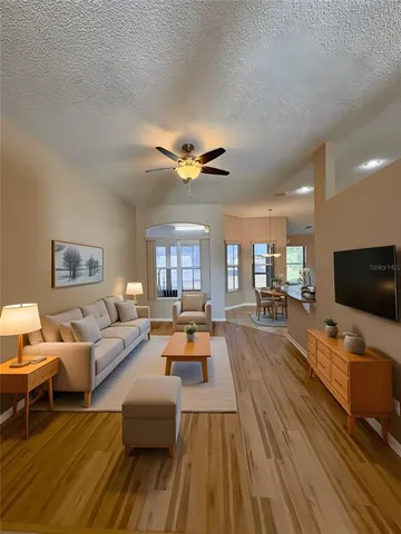 a living room with furniture and a flat screen tv