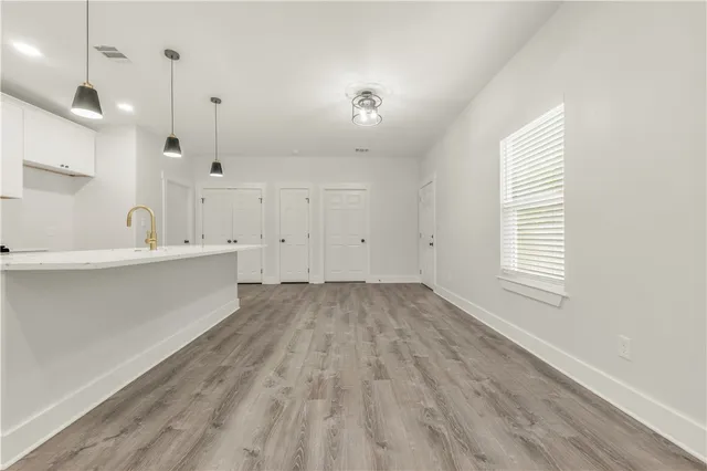 a view of a kitchen with marble kitchen and sink