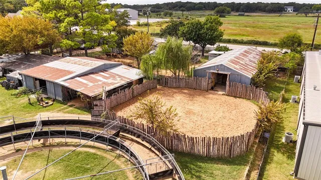 an aerial view of a house with swimming pool and ocean view