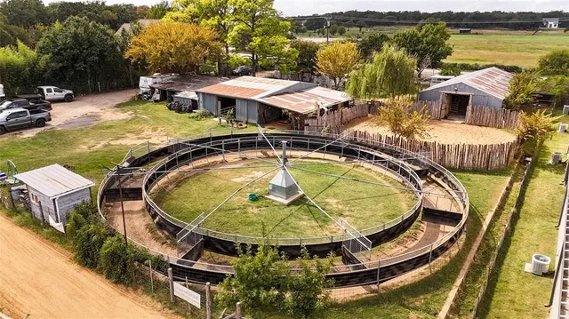 an aerial view of a house with swimming pool and ocean view