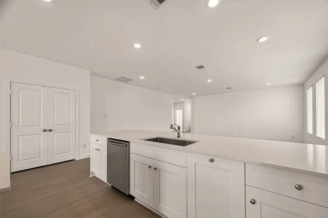 a kitchen with a sink and cabinets
