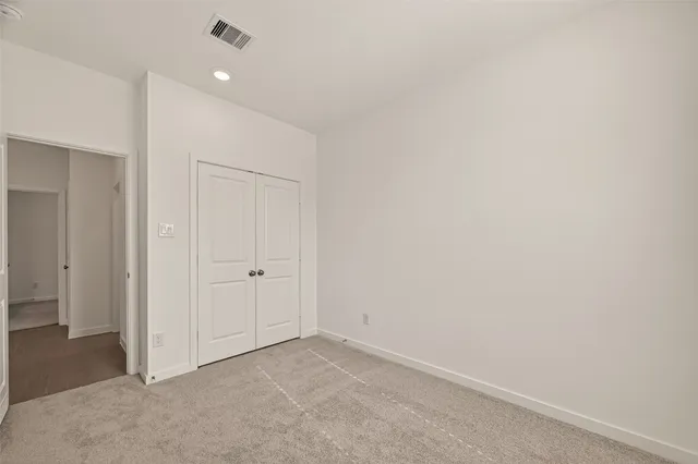 an empty room with a bathroom