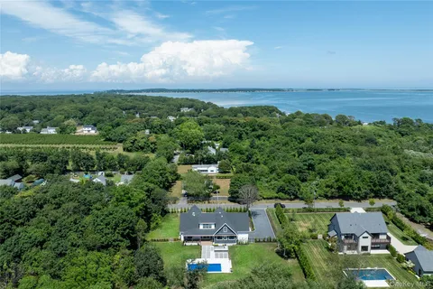 an aerial view of a house with a yard