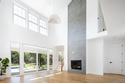 a view of an entryway with wooden floor