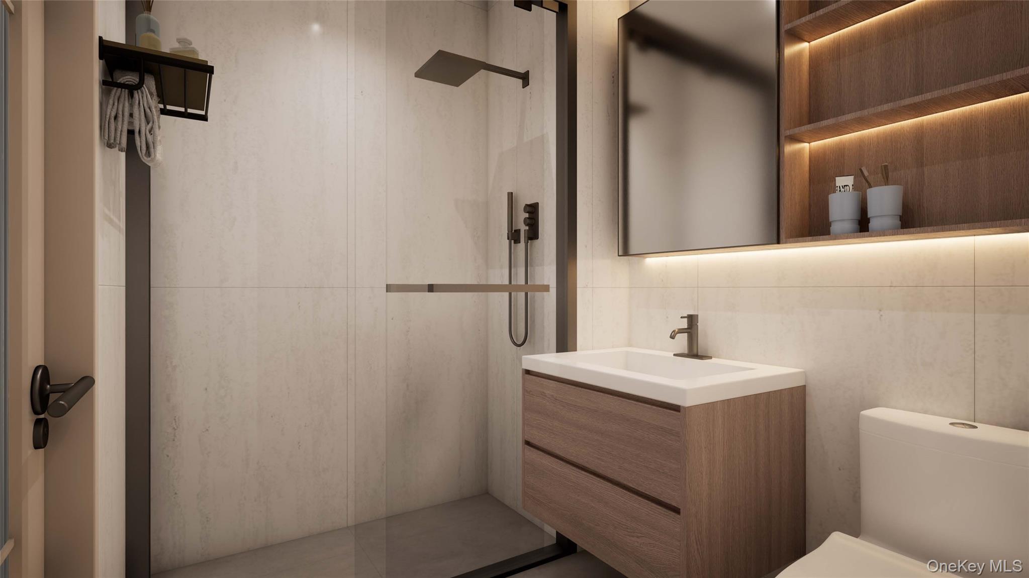 35-30 146th Street, Unit 307 Queens, NY 11354 - Photo 11 of 17 Bathroom featuring vanity, a walk in shower, and tile walls