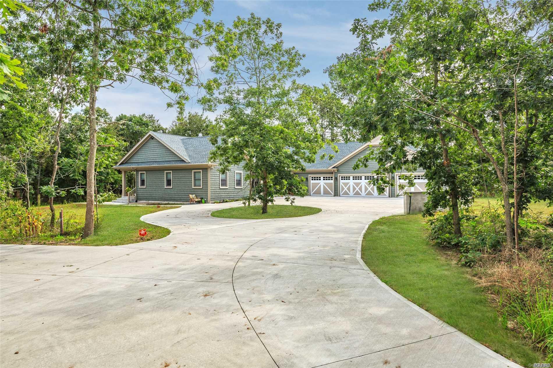 108 East Tiana Road Hampton Bays, NY 11946 - Photo 1 of 1 a view of house with outdoor space and street view