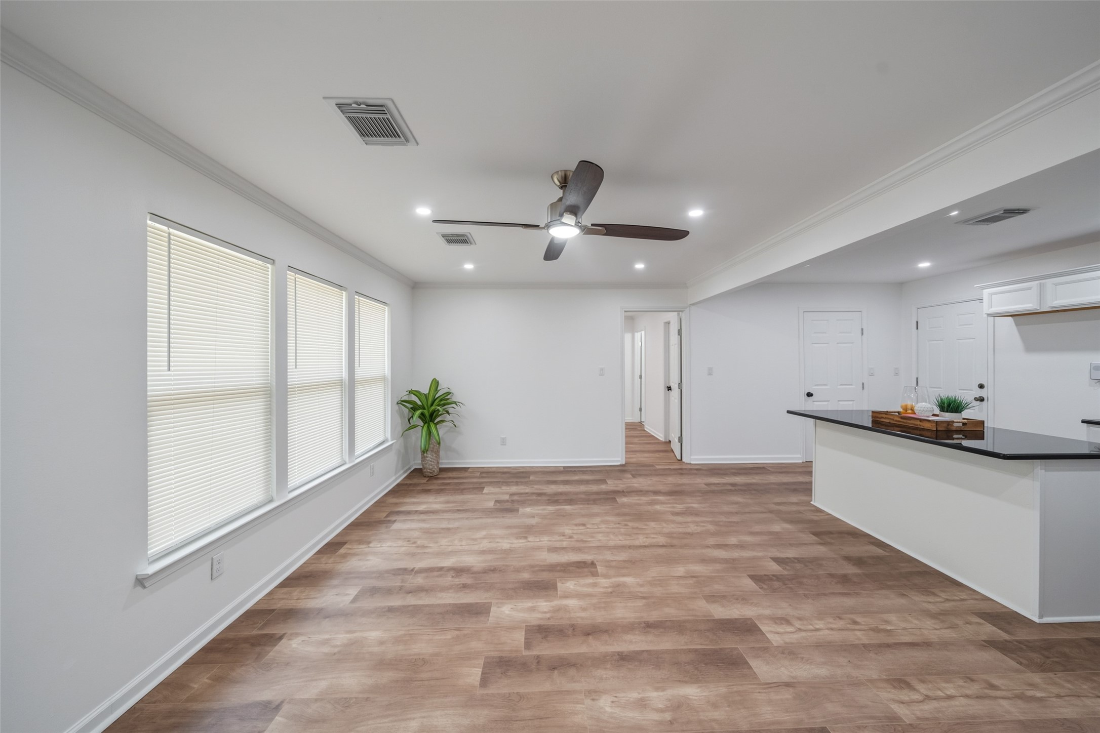 3051 Rothermel Road Houston, TX 77093 - Photo 5 of 24 Spacious living/dining area featuring a ceiling fan and elegant recessed lighting.