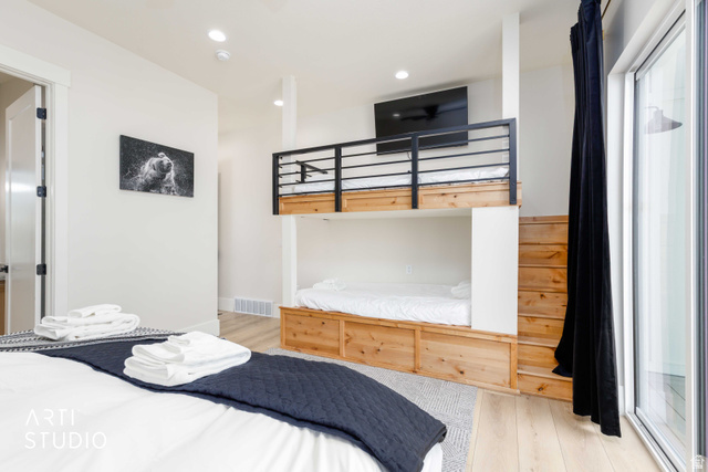 1188 South Old Trappers Loop Road Huntsville, UT 84317 - Photo 40 of 92 Modern bedroom featuring light wood-finish flooring, recessed lighting, and a built-in bunk bed system with wooden steps