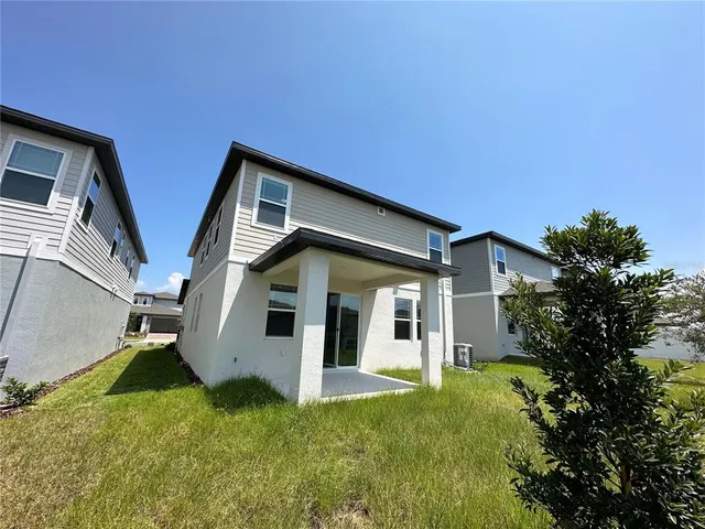 a view of an empty room and a window
