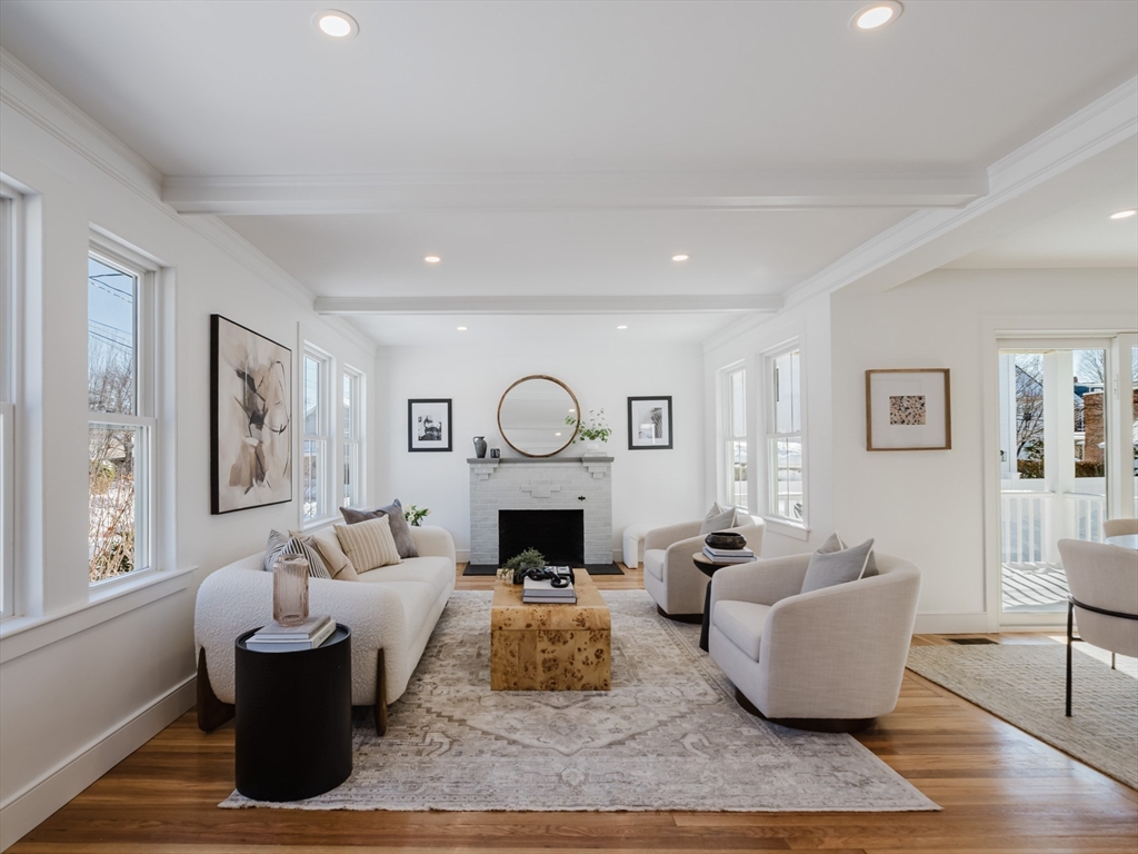 75 Foster Road, Unit 1 Belmont, MA 02478 - Photo 7 of 38 a living room with furniture and a fireplace