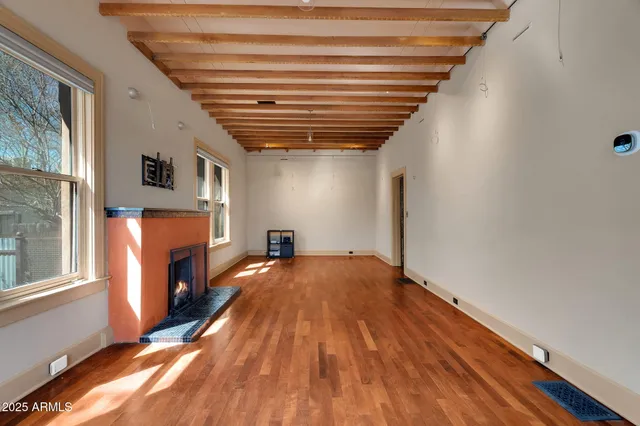 a view of a dining room with furniture and window