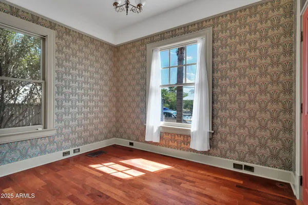 a view of a room with wooden floor and outdoor space