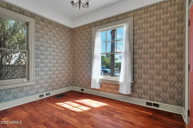 a view of a room with wooden floor and outdoor space
