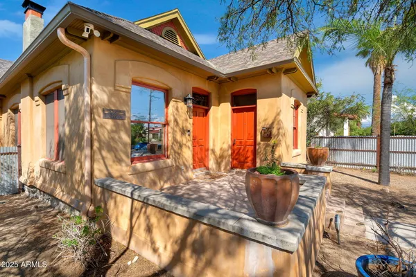 a view of fountain along the path and a fire pit