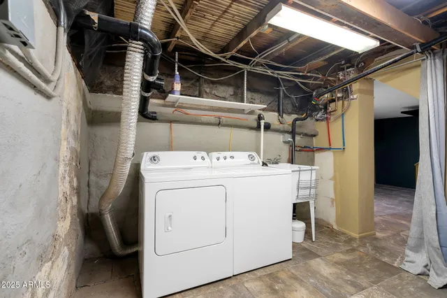 an aerial view of a house with garden space and a car park in front of the house