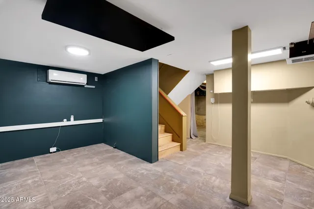 an aerial view of residential houses with city view