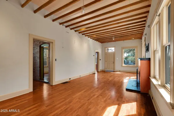 a view of empty room with window and fireplace