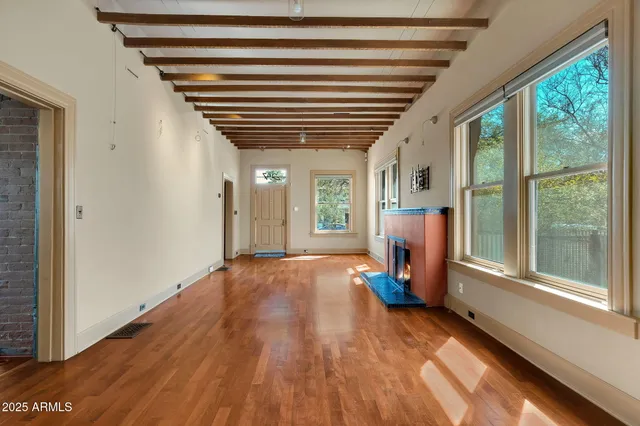 a view of a dining room with furniture and a potted plant