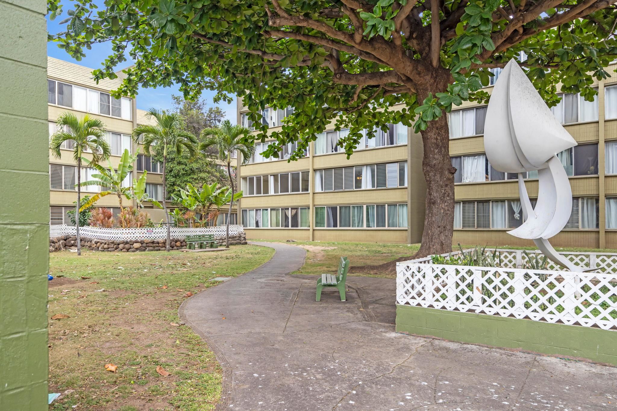 111 Kahului Beach Road, Unit A310 Kahului, HI 96732 - Photo 21 of 24 a view of a house with a yard and sitting area